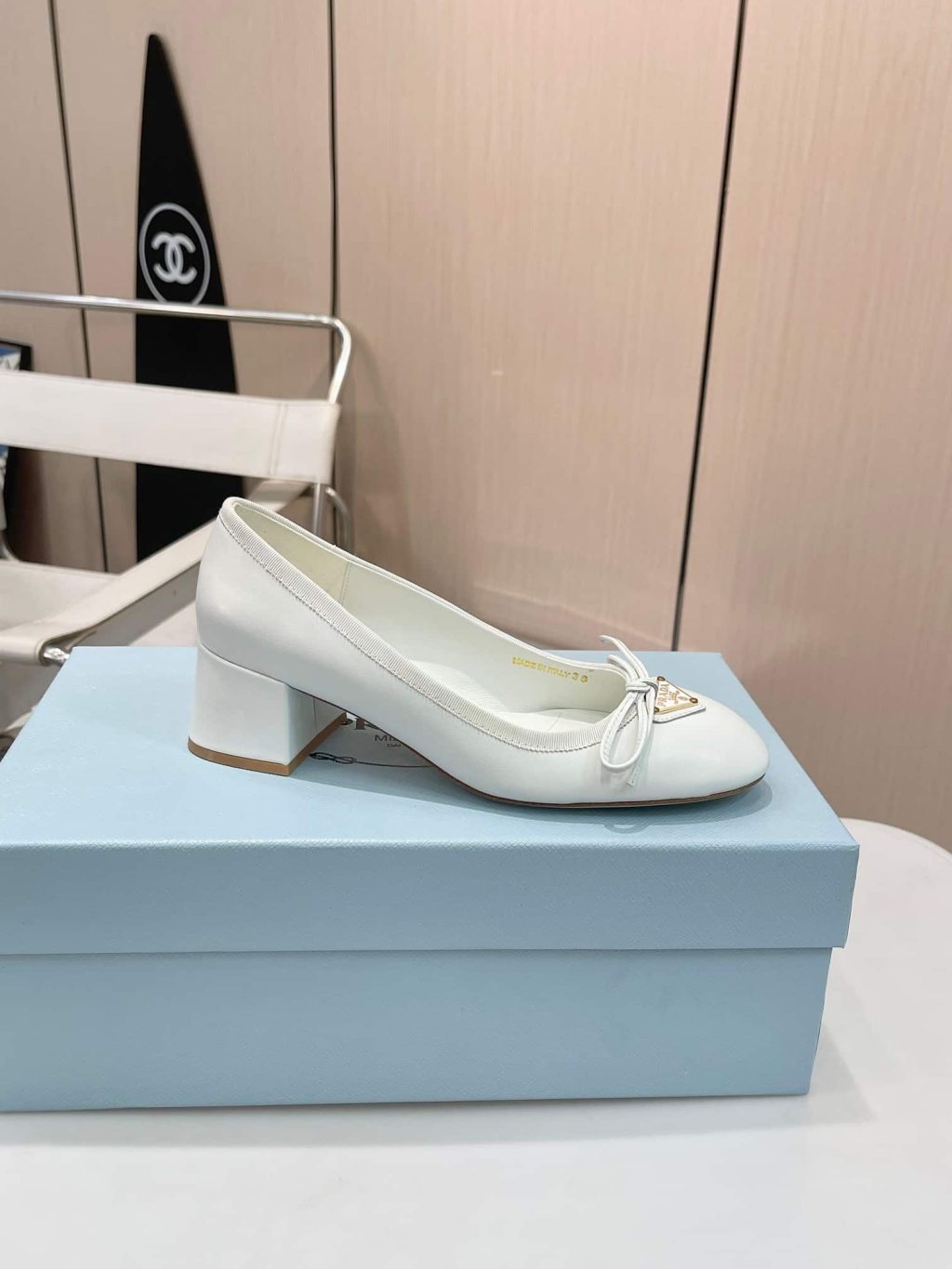 Prada Triangle Logo Bow Pump In White - Image 7