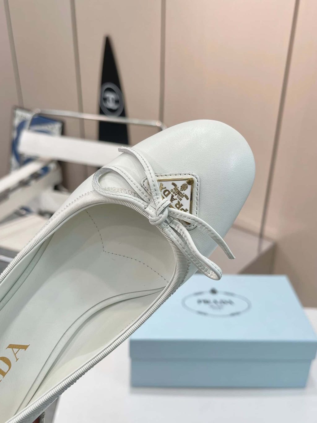 Prada Triangle Logo Bow Pump In White - Image 6