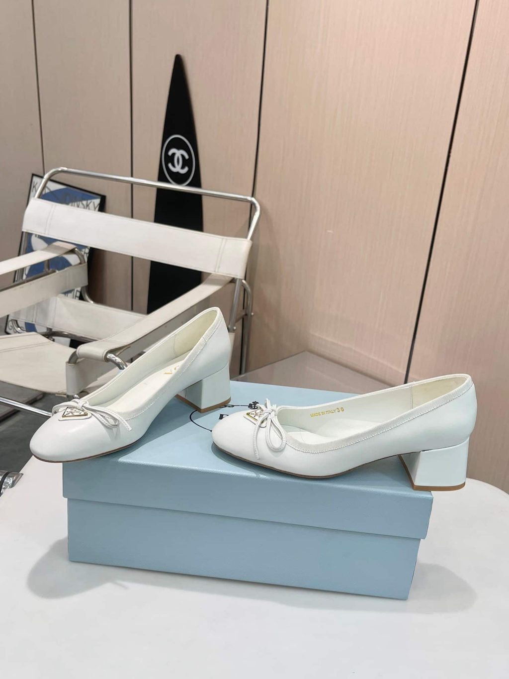 Prada Triangle Logo Bow Pump In White - Image 5